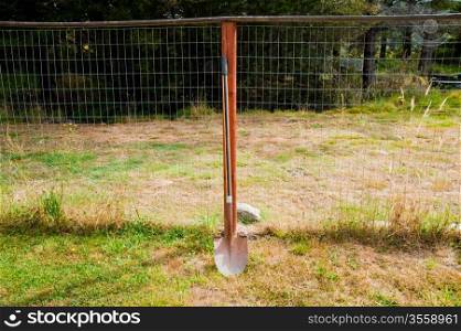 Shovel and fence