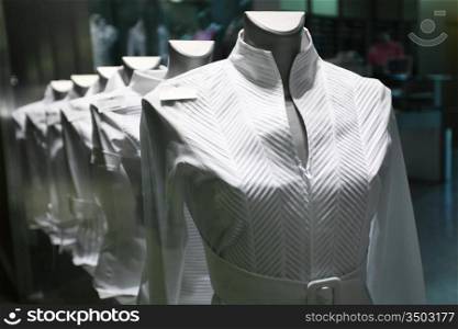 showcase with white clothes