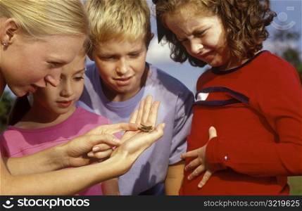 Showing Children A Grasshopper