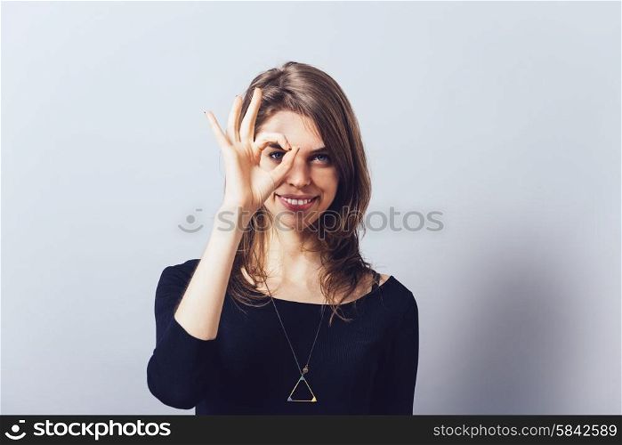 shows glasses out of fingers, against background