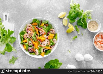 Shrimp, avocado and mango salad with fresh green lettuce. Prawn salad