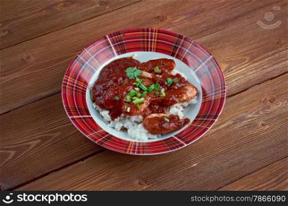 Shrimp Creole - dish of Louisiana Creole origin .cooked shrimp in mixture tomatoes, celery and bell pepper, spiced and served boiled white rice