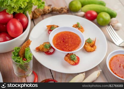 Shrimp deep-fried batter arranged beautifully in a white dish.