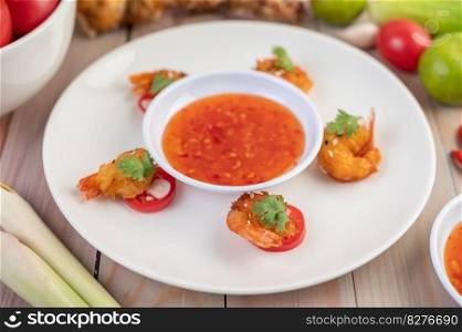 Shrimp deep-fried batter arranged beautifully in a white dish.