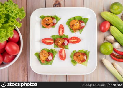 Shrimp deep-fried batter arranged beautifully in a white dish.