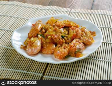 Shrimp DeJonghe specialty of Chicago, is a casserole of whole peeled shrimp blanketed in soft, garlicky, sherry-laced bread crumbs