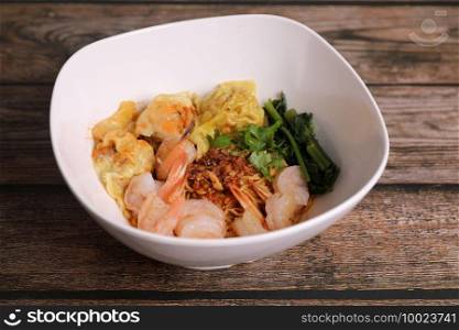 Shrimp dumpling with shrimp on wood background