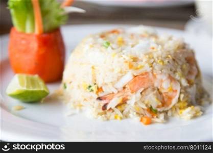 Shrimp fried rice in a white dish. Corn meal, the restaurant