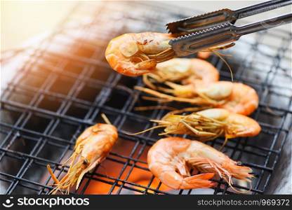 shrimp grilled bbq seafood on stove / prawns shrimps cooked burnt on grill barbecue