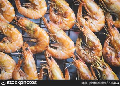 shrimp grilled bbq seafood on stove / prawns shrimps cooked burnt on grill barbecue