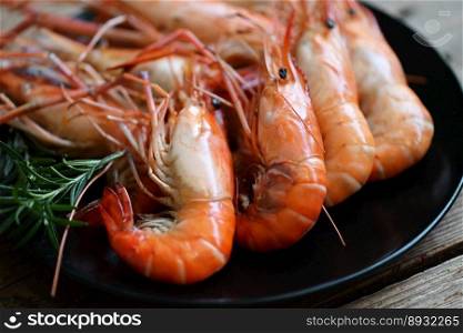 Shrimp grilled delicious seasoning spices on plate background, appetizing cooked shrimps baked prawns rosemary lemon lime pepper, Seafood shelfish 
