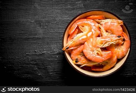 Shrimp In a bowl. On the black chalkboard.. Shrimp In a bowl.