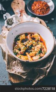 Shrimp in chili tapas with herbs