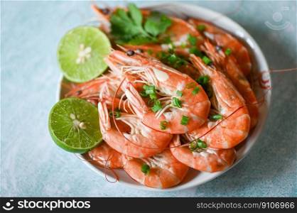 shrimp on white bolw and wooden background dining table food, Fresh shrimps prawns seafood lemon lime with herbs and spice, top view
