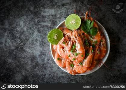 shrimp on white plate background dining table food, Fresh shrimps prawns seafood lemon lime with herbs and spice, top view