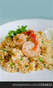 shrimp over fried rice on dish