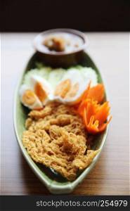 Shrimp paste sauce with crispy fried fish and egg