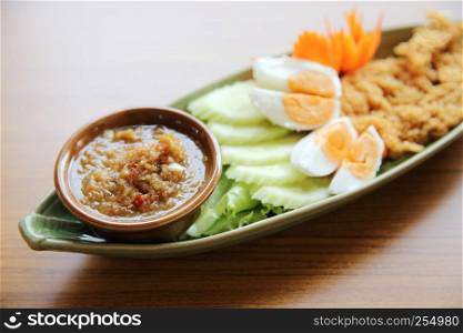 Shrimp paste sauce with crispy fried fish and egg