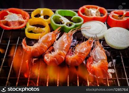 shrimp,prawn grilled on barbecue stove with chilly and onion ring
