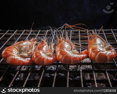 shrimp ,prawns grilled on barbecue fire stove