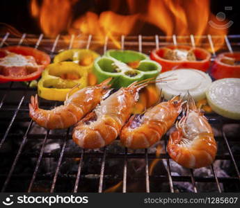 shrimp,prawns grilled on barbecue fire stove with chilly onion for seafood meal