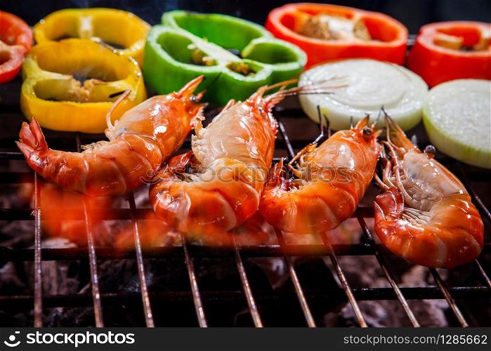 shrimp,prawns grilled on barbecue fire stove with chilly onion for seafood meal