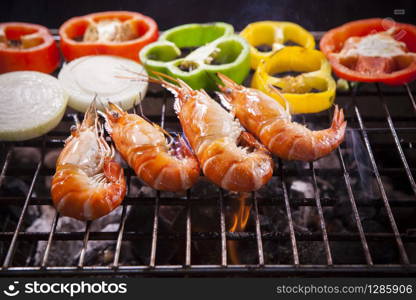 shrimp,prawns grilled with chilly and onion on barbecue stove