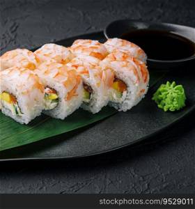 shrimp rolls on black stone plate