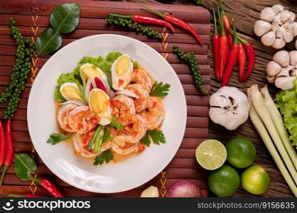 Shrimp Salad with Boiled Egg Lettuce and chopped scallions in a white plate