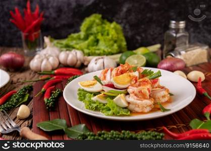 Shrimp Salad with Boiled Egg Lettuce and chopped scallions in a white plate