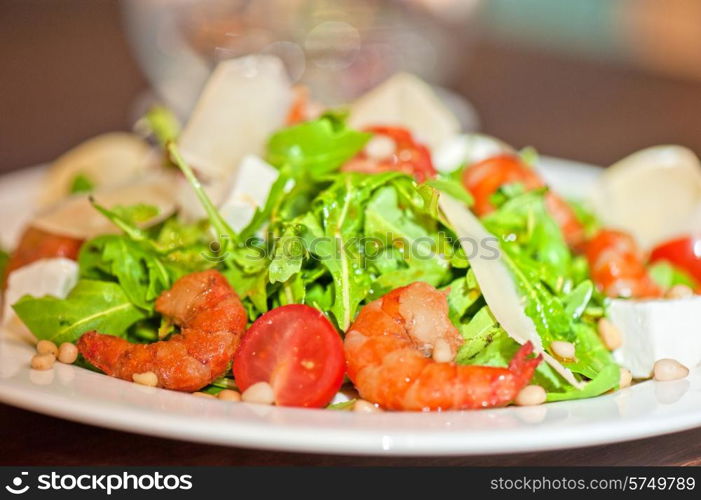 shrimp salad with cheese and arugula. shrimp vegetable salad