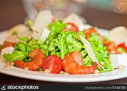 shrimp salad with cheese and arugula. shrimp vegetable salad