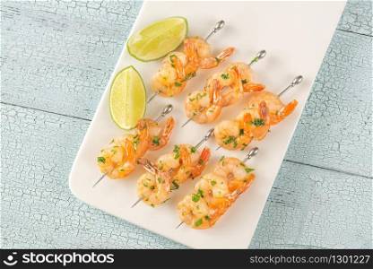 Shrimp skewers on the white plate