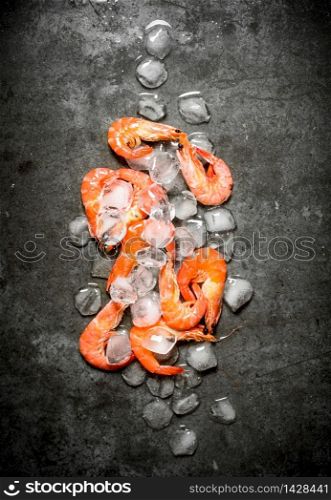Shrimp with ice . On a stone background.. Shrimp with ice .
