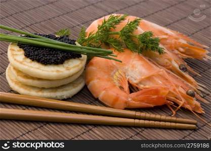 shrimps and caviar. appetizer food with shrimp, caviar and chives