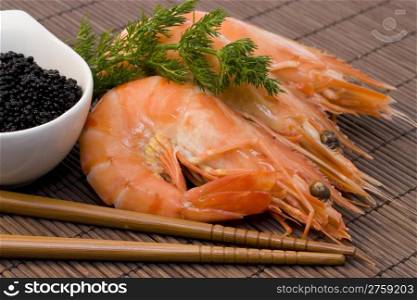 shrimps and caviar. fresh shrimps served with black caviar