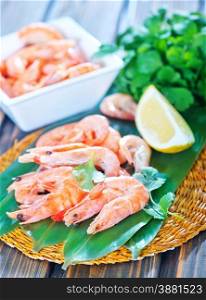 shrimps and lemon on the wooden table