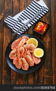 shrimps on plate and on a table