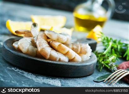 shrimps on wooden board and on a table