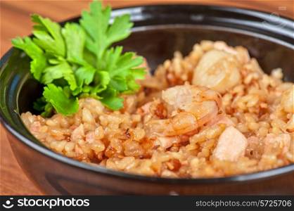 Shrimps risotto garnished with fresh parsley
