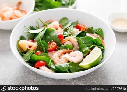 Shrimps spinach tomato fresh salad, low carb ketogenic, keto diet. Healthy food