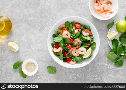 Shrimps spinach tomato fresh salad, low carb ketogenic, keto diet. Healthy food. Top view