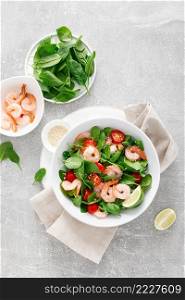 Shrimps spinach tomato fresh salad, low carb ketogenic, keto diet. Healthy food. Top view