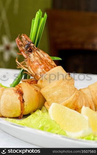 shrimps, with lettuce, green onion, lemon and black olive