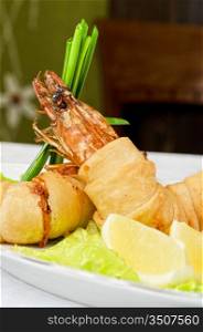 shrimps, with lettuce, green onion, lemon and black olive