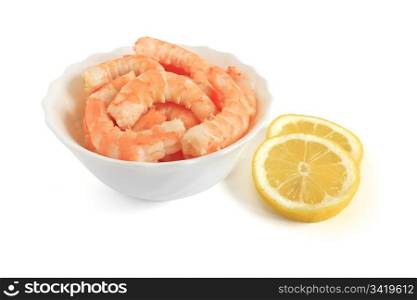 shrimps with sliced lemon in a bowl over white background