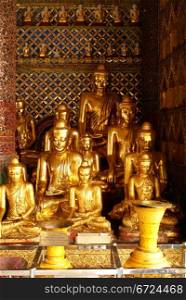 Shrine with golden buddhas in Shwedagon Paya, Yangon, Myanmar