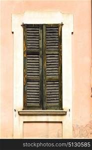 shutter europe italy lombardy in the milano old window closed brick abstract grate