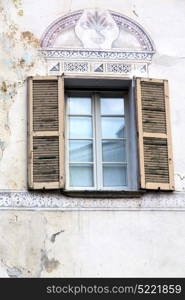 shutter europe italy lombardy in the milano old window closed brick abstract grate