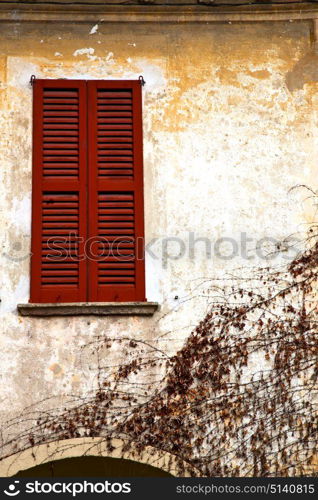 shutter europe italy lombardy in the milano old window closed brick abstract grate red